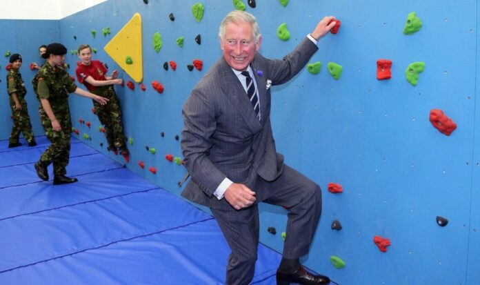 King Charles goes viral in unearthed ‘Mission Impossible’-style clip climbing wall in suit