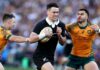 New Zealand's Will Jordan evades a tackle from Australia's Tom Wright and Nic White in their September 2024 Bledisloe Cup match in Sydney.