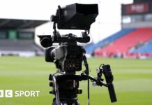 A TV camera pitchside at Sale Sharks' AJ Bell Stadium