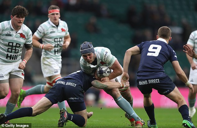 Nick Koster is tackled during the Oxford University vs Cambridge University Men's Varsity match at Twickenham Stadium on December 7, 2017