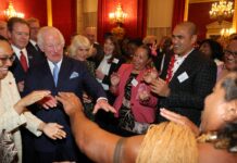 Upbeat Charles shows off his dance moves as he welcomes Grace Jones & ex-rugby star at glitzy Commonwealth reception