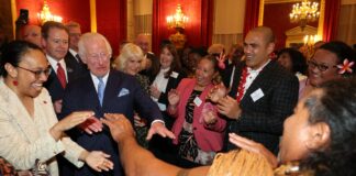 Upbeat Charles shows off his dance moves as he welcomes Grace Jones & ex-rugby star at glitzy Commonwealth reception