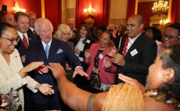 Upbeat Charles shows off his dance moves as he welcomes Grace Jones & ex-rugby star at glitzy Commonwealth reception