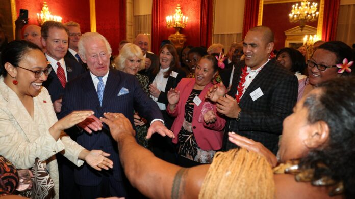 Upbeat Charles shows off his dance moves as he welcomes Grace Jones & ex-rugby star at glitzy Commonwealth reception