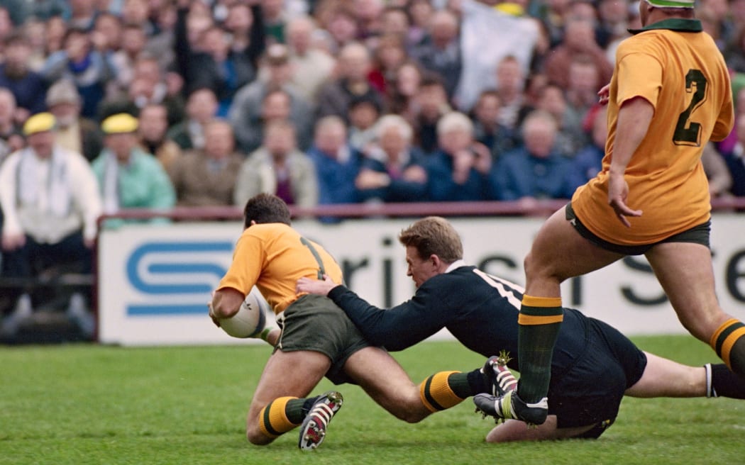 David Campese scores a try in the tackle of John Kirwan in the 
1991 Rugby World Cup Semi Final.