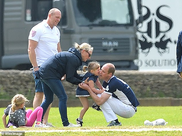 Mike and Zara's daughter Mia hugs William at a charity polo match in 2017