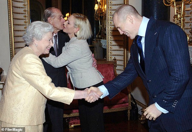 Mike shaking hands with Queen Elizabeth at a Buckingham Palace reception in 2006