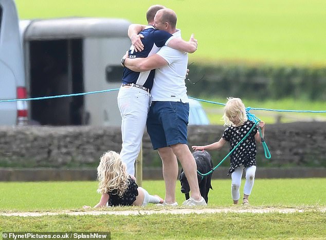 Mike and William embrace at a charity polo match in Gloucestershire  in 2017