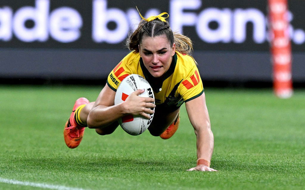 Jakiya Whitfeld dives in for a try for Australia Jillaroos against the PNG Orchids.