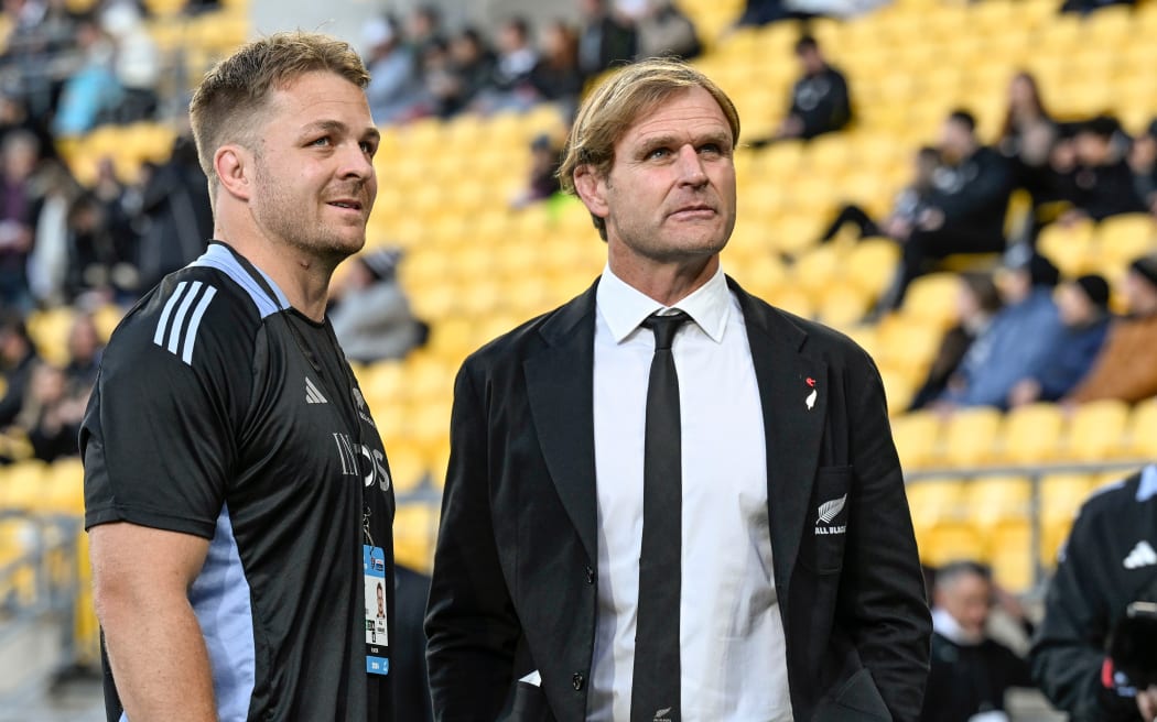 Sam Cane of New Zealand and New Zealand coach Scott Robertson.