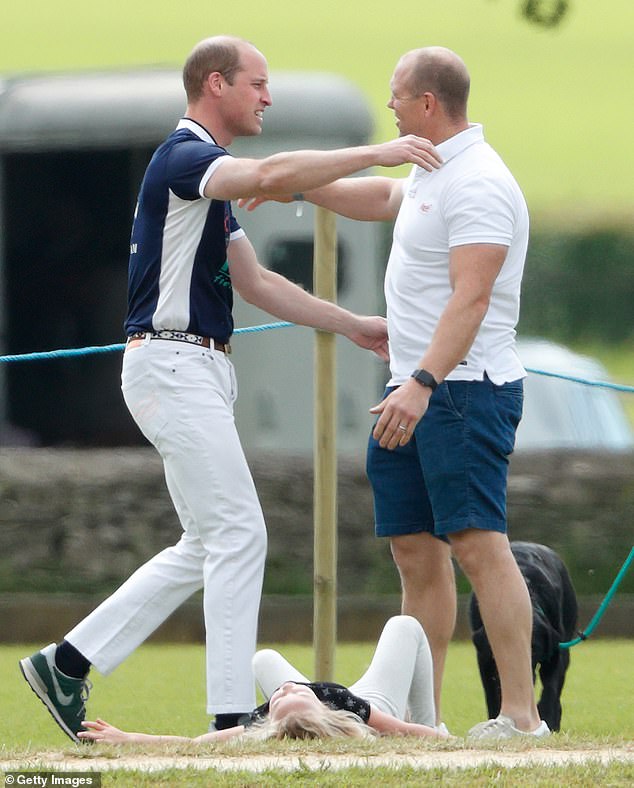 Prince William and Mike Tindall are pictured going in for a hug at a Polo match in 2017