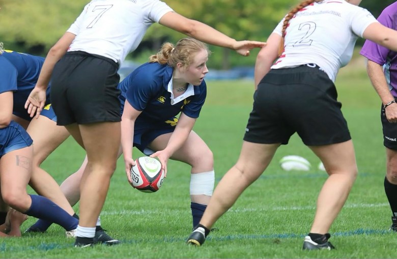 Lauren Donatoni toss the ball out of the scrum.