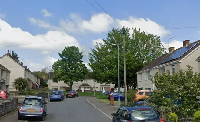 The bodies of the married couple were found at the house in Morfa Crescent