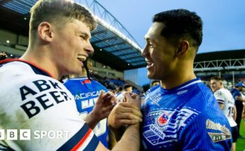 George Williams wrestles his way forward under pressure from the Samoa defence who are wrapping him up with tackles