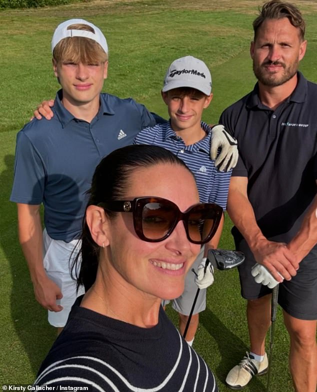 Last month, Kirsty opened up about how she fell for her partner Darren after they bonded over being single parents (pictured with her two sons Oscar and Jude)