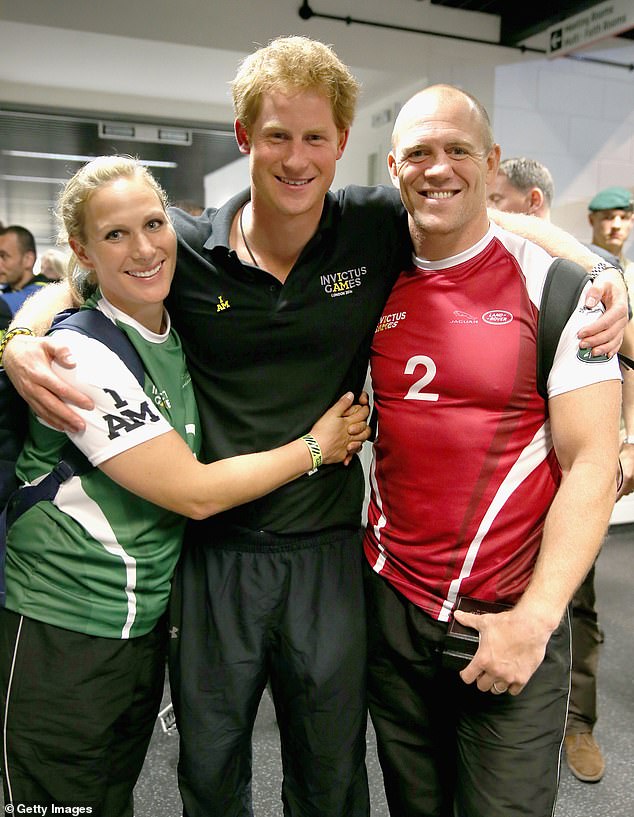 Zara Tindall, Prince Harry and Mike Tindall are pictured in 2014 donning rugby uniform