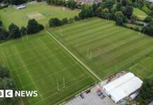 Drone picture showing four rugby pitches flanked by trees