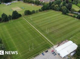 Drone picture showing four rugby pitches flanked by trees