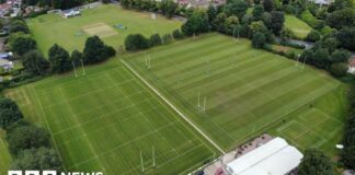 Drone picture showing four rugby pitches flanked by trees