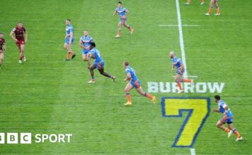 Headingley Stadium with a tribute to Rob Burrow on the pitch during a game