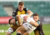 Andre Esterhuizen of Hollywoodbets Sharks is tackled by Harry Wilson of Dragons and Shane Lewis-Hughes of Dragons 