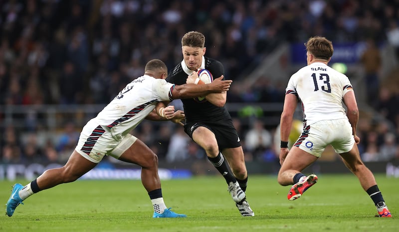 New Zealand's Beauden Barrett is tackled by England's Ollie Lawrence (left) and Henry Sladeduring during their Autumn Nations Series fixture at Twickenham. Photograph: David Rogers/Getty Images