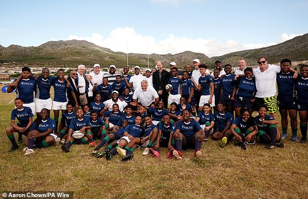 The Prince of Wales poses for a photo at Ocean View Secondary School in Cape Town today