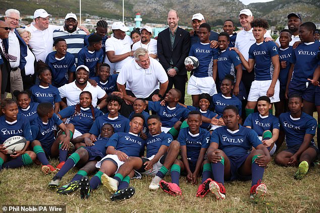 The Prince of Wales poses for a photo at Ocean View Secondary School in Cape Town today