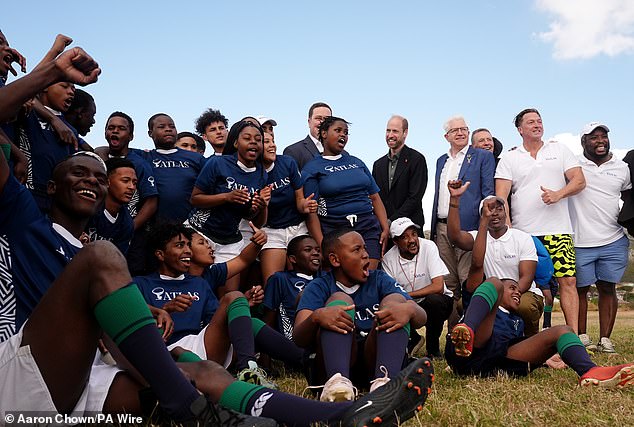 The Prince of Wales poses for a photo at Ocean View Secondary School in Cape Town today