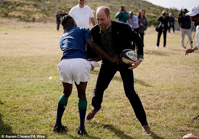 Prince William during a rugby session at Ocean View Secondary School in Cape Town today