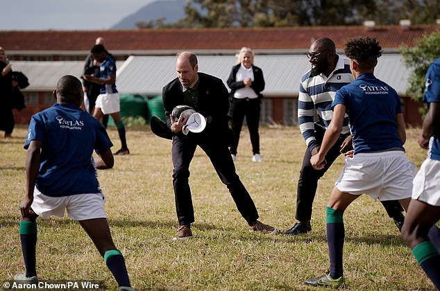 The Prince of Wales plays rugby today at Ocean View Secondary School in Cape Town