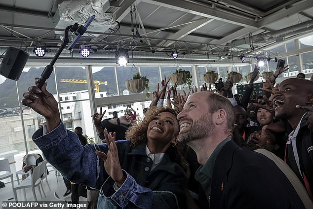 Prince William takes a selfie with South African actress Nomzamo Mbatha in Cape Town today