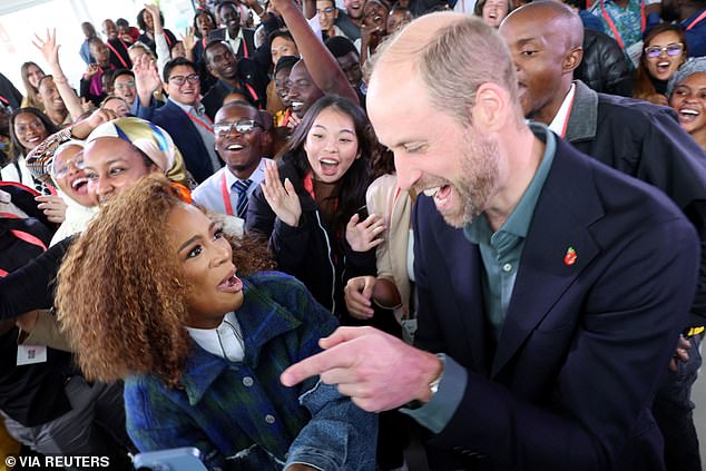 Prince William with Nomzamo Mbatha after taking a selfie in Cape Town today