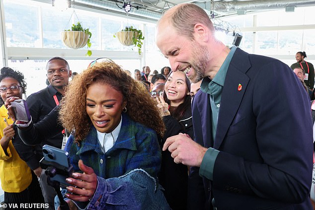 Prince William with Nomzamo Mbatha after taking a selfie in Cape Town today