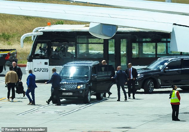 Prince William gets into a car at Cape Town Airport today as his visit to South Africa begins