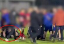 Shocking moment kids' rugby game explodes into violence as youngsters 'stamp and kick man on the ground'