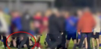 Shocking moment kids' rugby game explodes into violence as youngsters 'stamp and kick man on the ground'