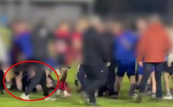 Shocking moment kids' rugby game explodes into violence as youngsters 'stamp and kick man on the ground'