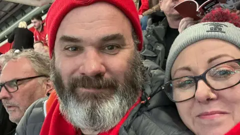 Natalie Marchant Parry Selfie of a man and woman at rugby match