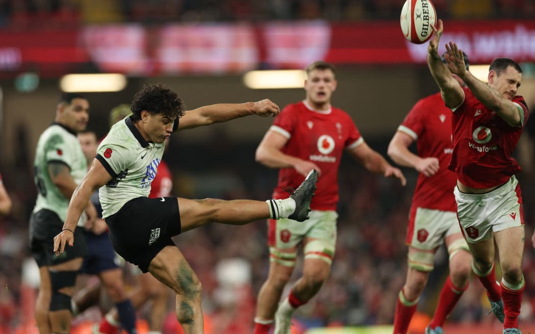 Fiji's fly-half Caleb Muntz has his kick charged down during the Autumn Nations Series International rugby union test match between Wales and Fiji at the Principality Stadium, in Cardiff on November 10, 2024. (Photo by Adrian Dennis / AFP) / RESTRICTED TO EDITORIAL USE -USE IN BOOKS SUBJECT TO WELSH RUGBY UNION (WRU) APPROVAL