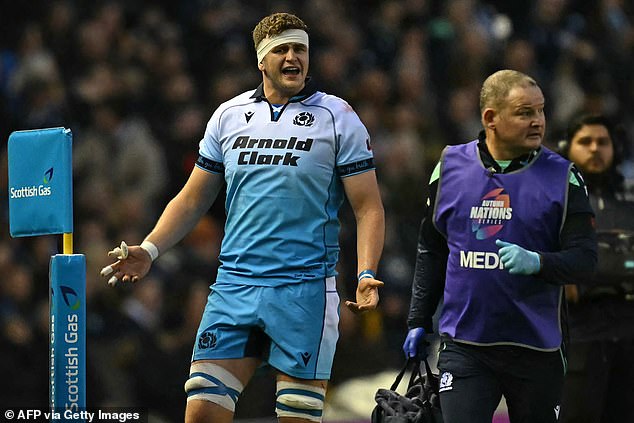 Scott Cummings looks bemused after being sent off for a 'croc roll' tackle