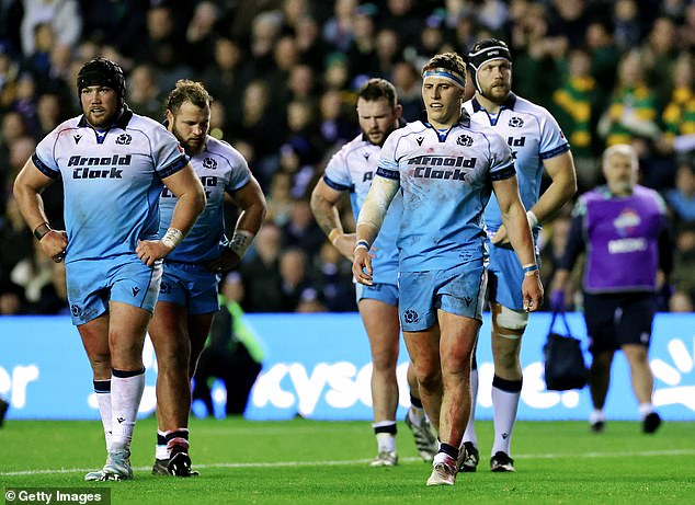 Scotland players leave the field after a frustrating match against the Springboks