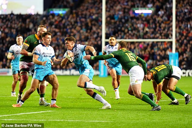 Tom Jordan gets past South Africa's Willie Le Roux during Sunday's match