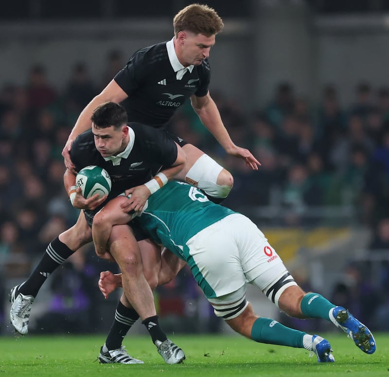 New Zealand’s Will Jordan is tackled by Caelan Doris. Photograph: Billy Stickland/Inpho