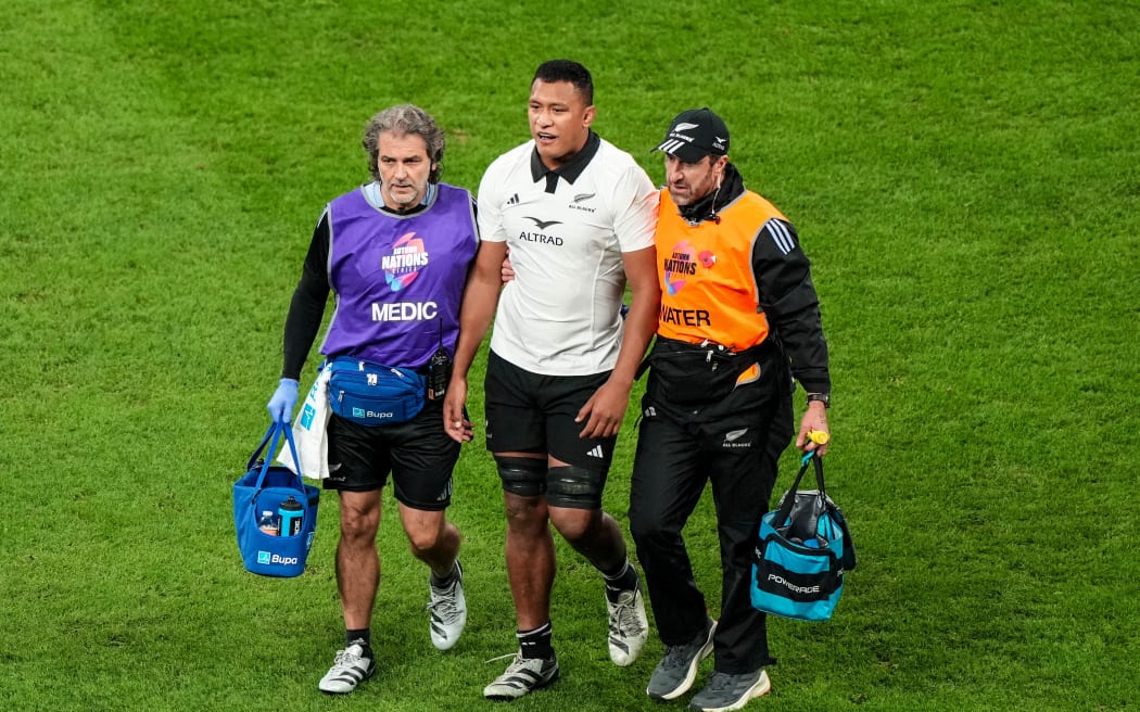 New Zealand's Samipeni Finau is assisted from the field, France, 2024.