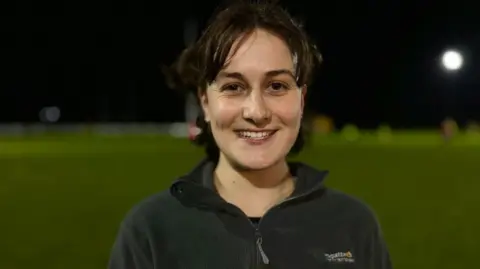 Martin Giles/BBC Women's rugby player Cat Hamilton at a training ground in Cambridge.