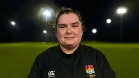 Martin Giles/BBC Rugby player and coach Sophie Sparsis at a training ground in Cambridge