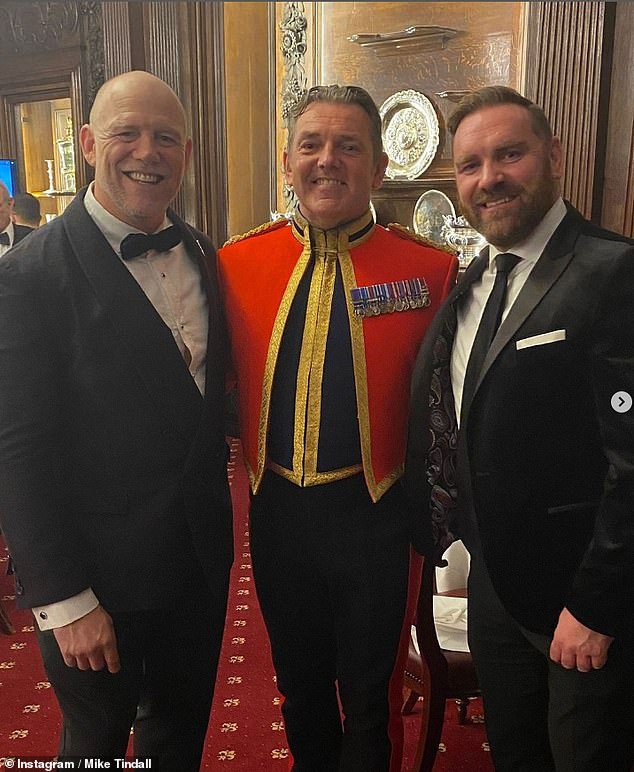 Mike and Zara smiled as they took photos with other attendees, both sporting red poppies in commemoration of the event