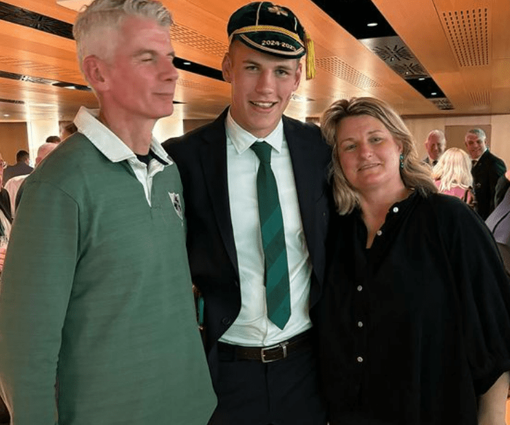 A sweet family snap with the cap he'll treasure for the rest of his life