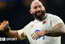 Joe Marler throwing a mini rugby ball.